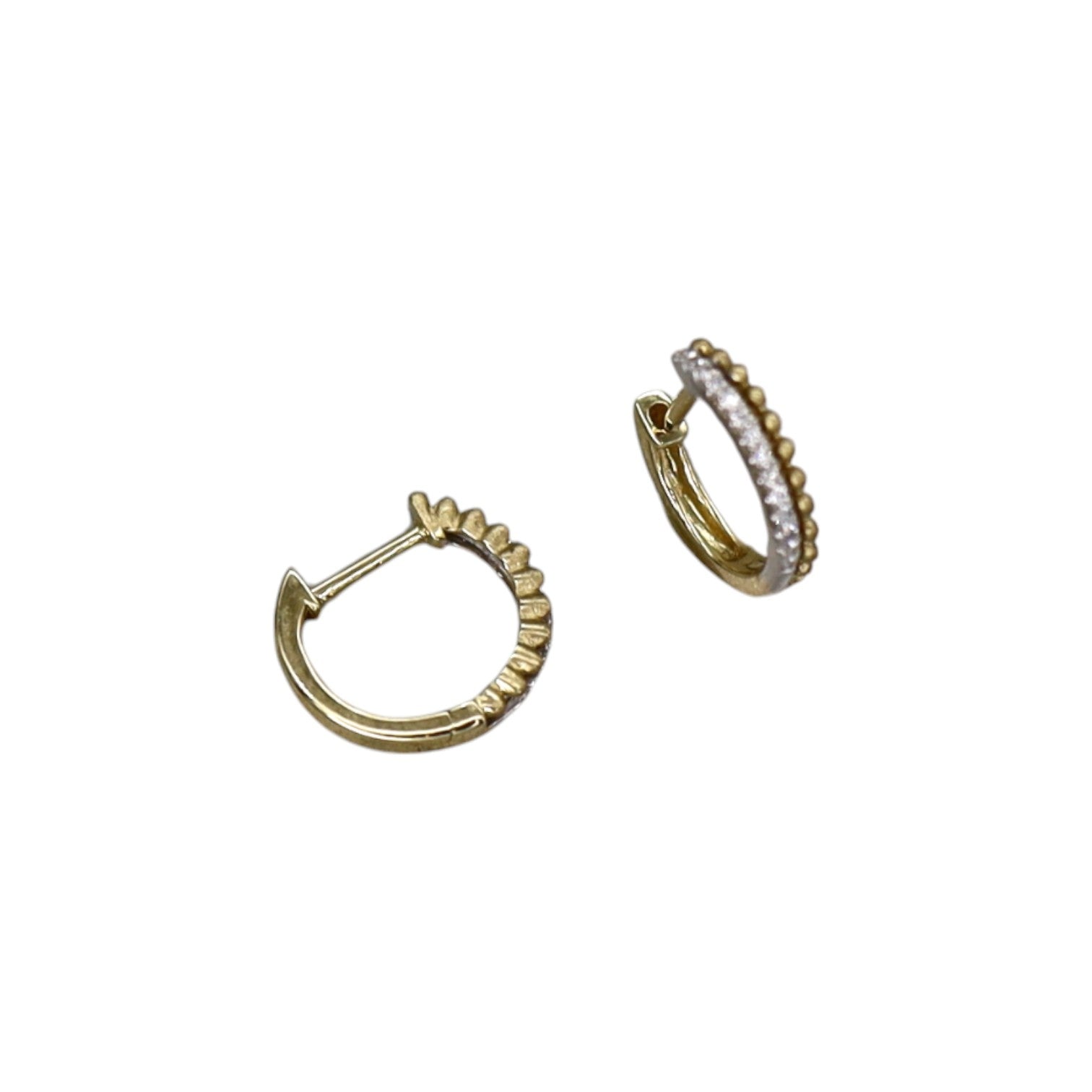 Two-tone diamond and bead huggie earrings by Dilamani, featuring sparkling diamonds and textured beads in a stylish hoop design.