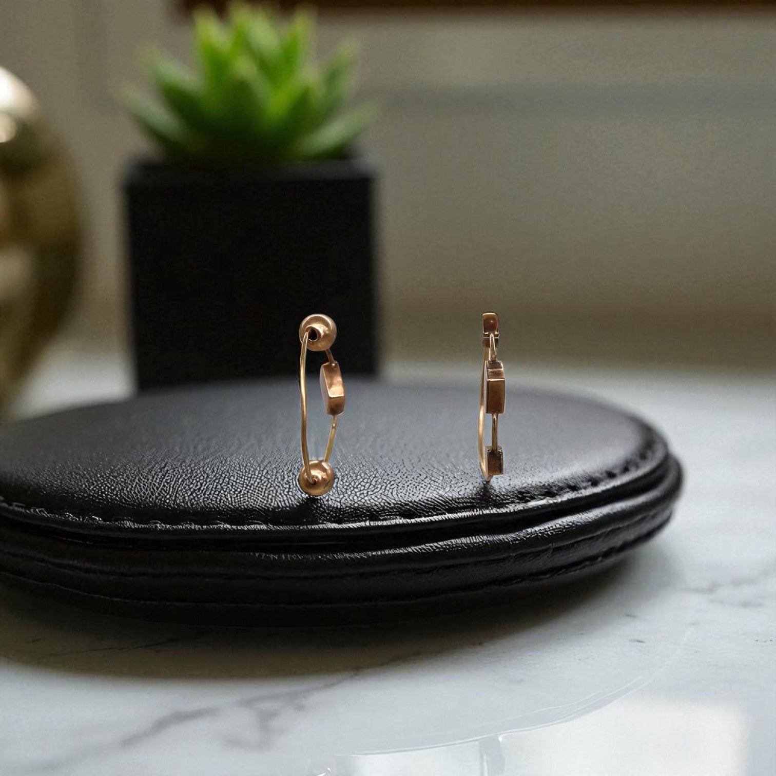 Handmade Victorian mismatched 10k pink gold hoop earrings with intricate detailing and vintage-inspired design.