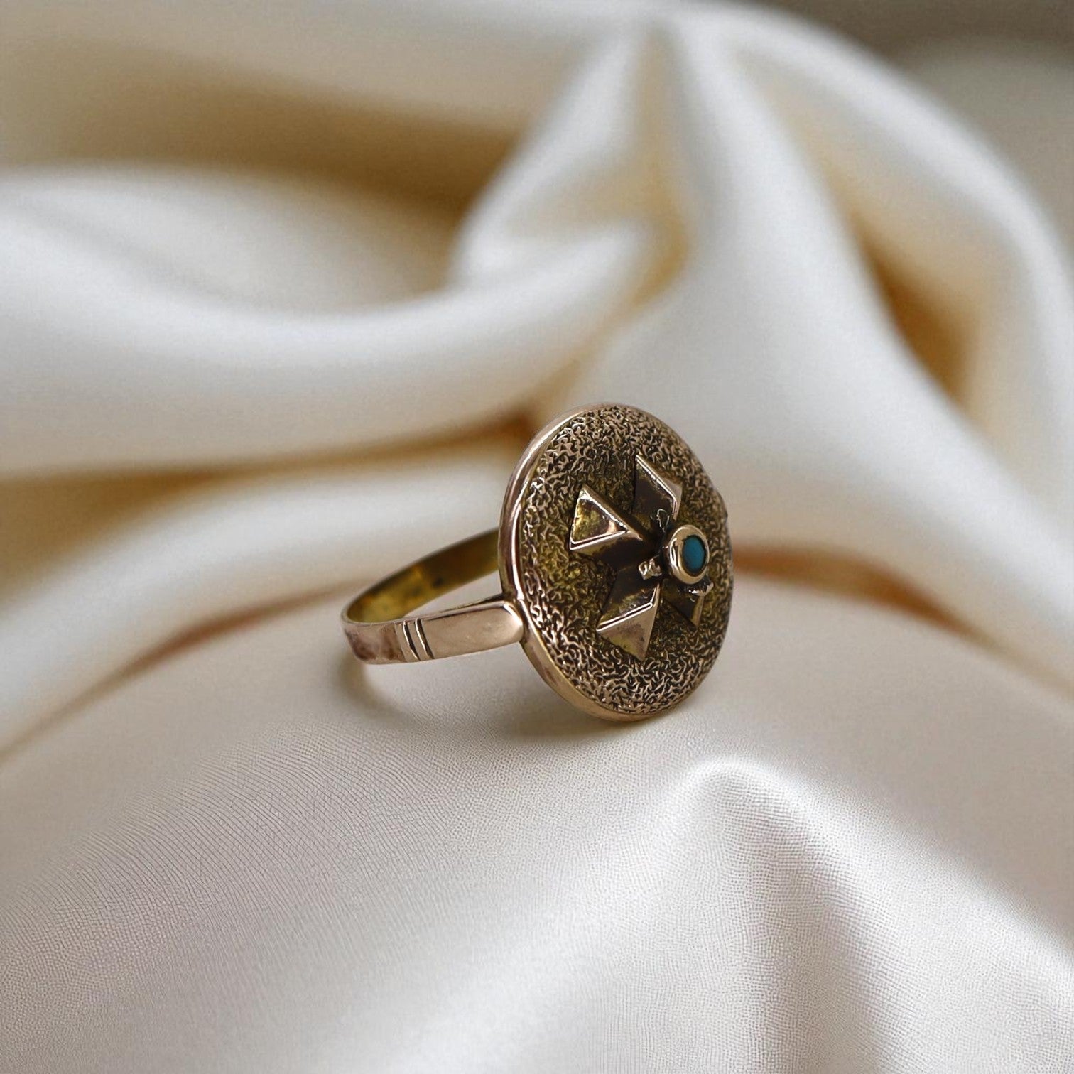 Victorian turquoise ring featuring intricate vintage design and silver band, crafted by The Vintage Vault.