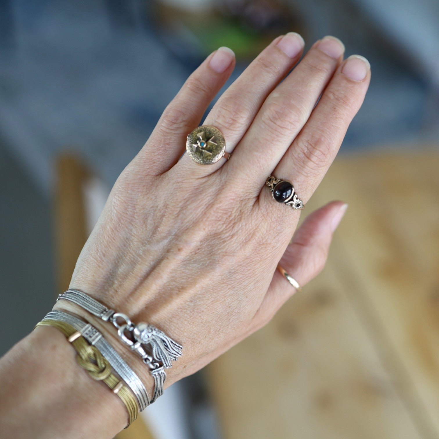 Victorian Garnet Ring featuring a deep red garnet gemstone set in an intricate vintage gold ring design.