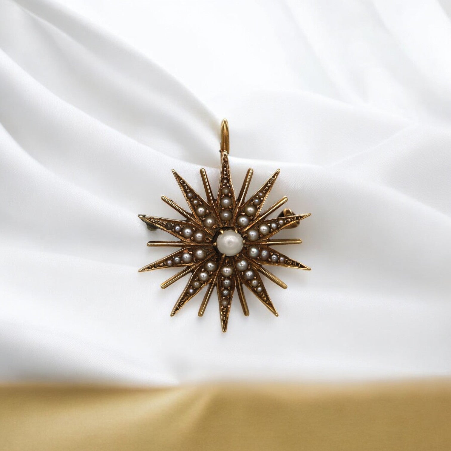 Victorian Pearl Starburst Convertible Pendant featuring a pearl centerpiece and intricate vintage design, crafted by The Vintage Vault.