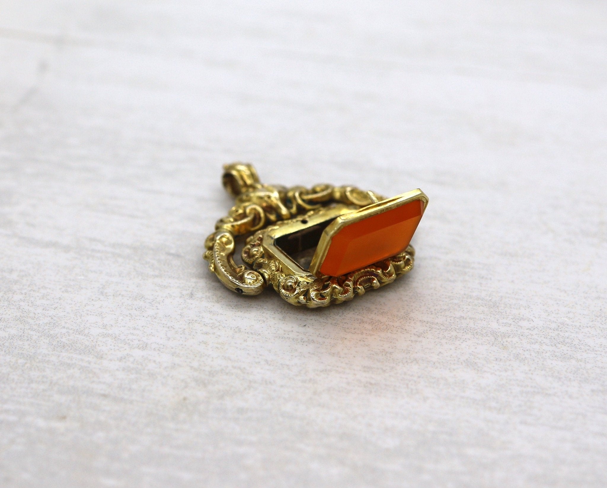 Antique Carnelian Locket Fob with Intricate Repoussé Hunting Dog Design - Petra Star