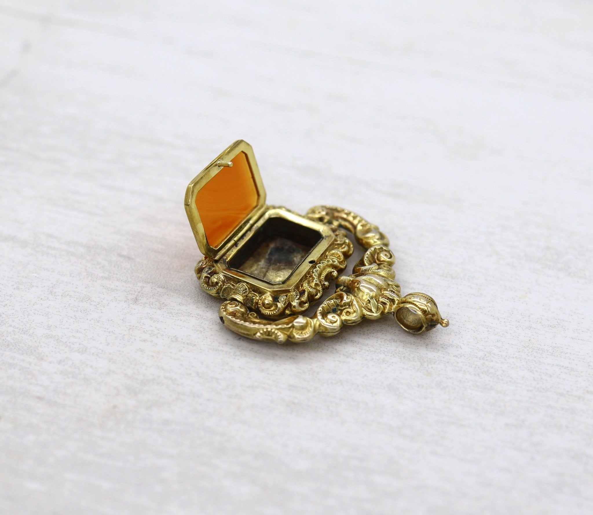 Antique Carnelian Locket Fob with Intricate Repoussé Hunting Dog Design - Petra Star