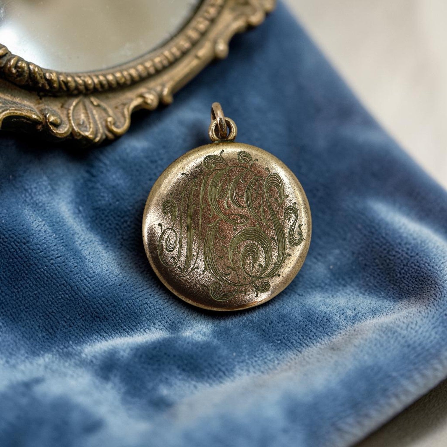 Antique Art Nouveau gold-filled lion pendant locket with paste accents, monogrammed NES, circa 1905, vintage jewelry accessory.