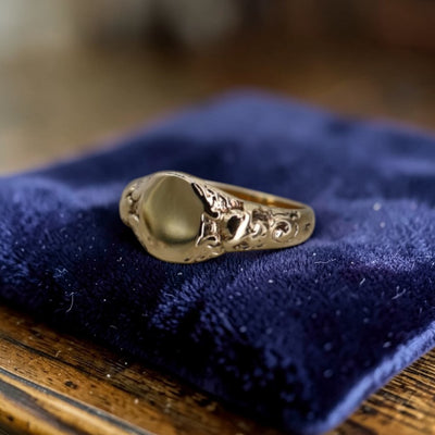 Art Nouveau signet ring in 10k yellow gold with intricate scrollwork shoulders, customizable and crafted by The Vintage Vault.