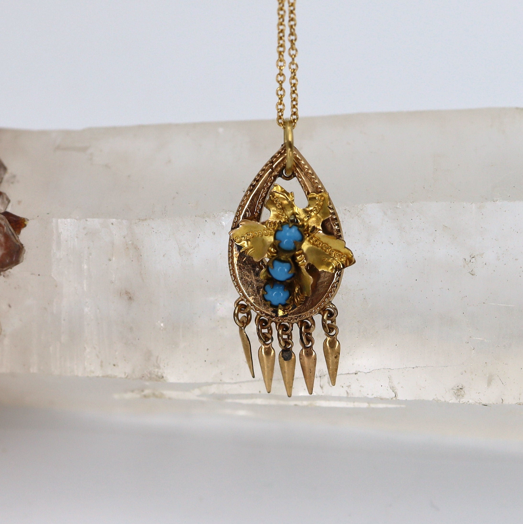 Gold-filled Etruscan Revival turquoise pendant featuring a tassel design, crafted by The Vintage Vault.