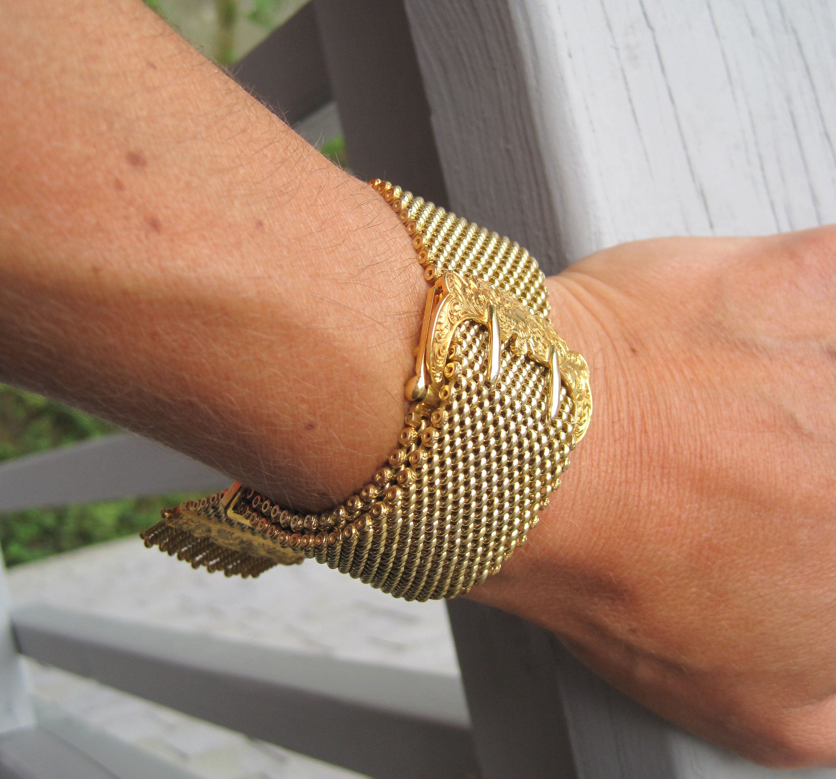 Victorian mesh buckle bracelet in 18k yellow gold from circa 1890, featuring intricate vintage craftsmanship.