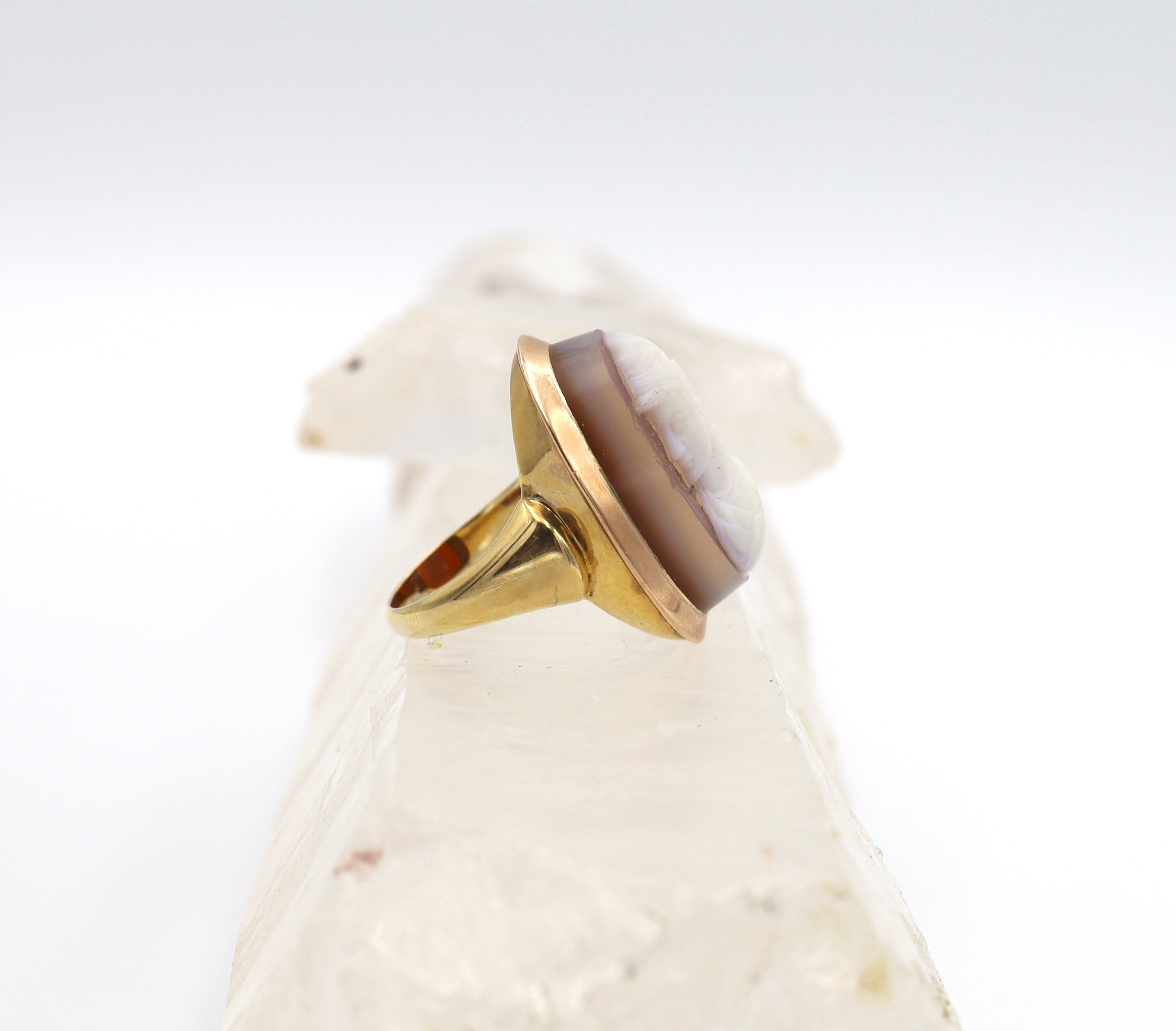 Victorian stone cameo ring with carved agate in 14k yellow gold, featuring intricate vintage design and detailed carved portrait.