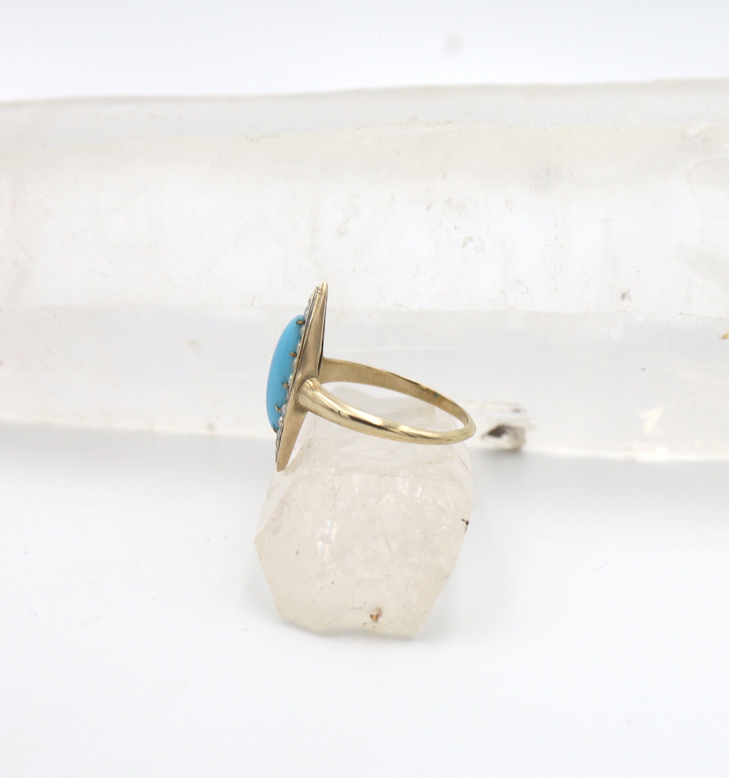 Victorian turquoise and pearl navette ring with intricate design, vintage style, from The Vintage Vault.