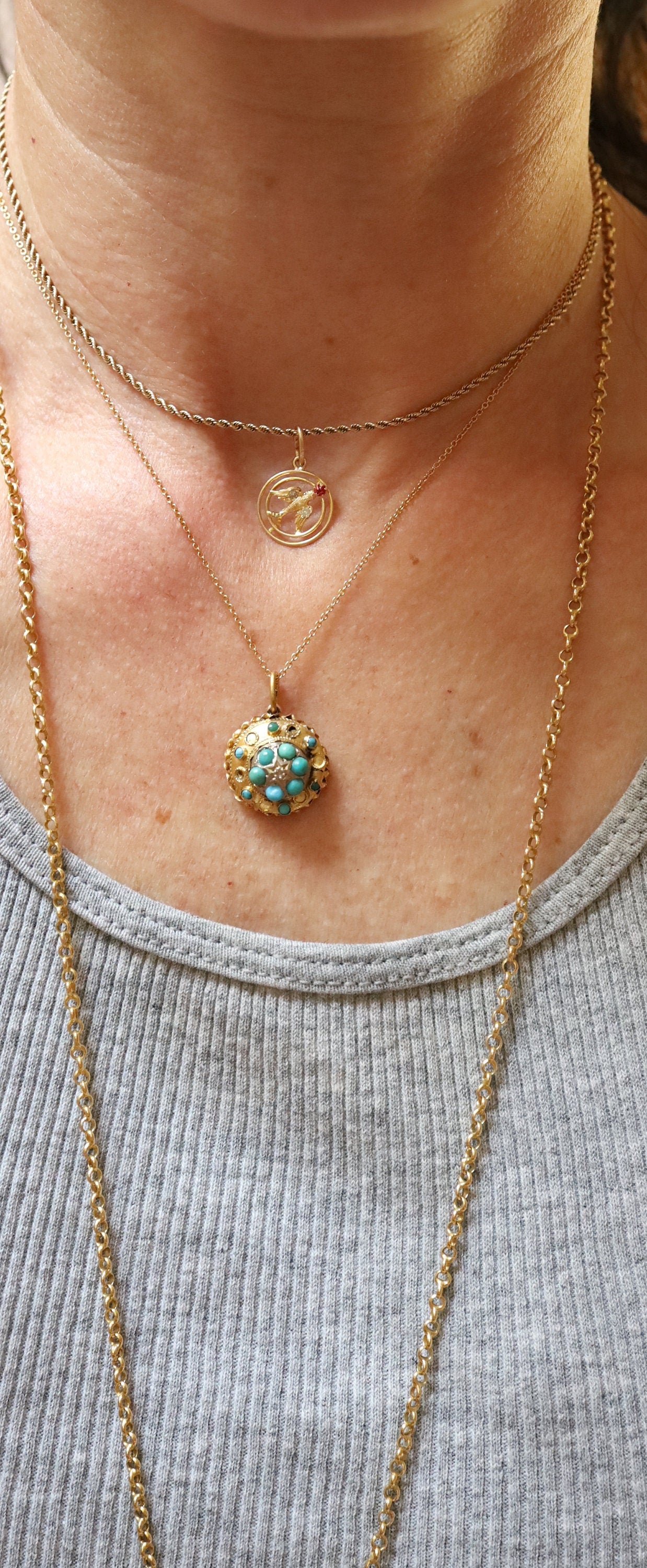 Etruscan Revival turquoise and diamond charm pendant in 15k yellow gold, featuring intricate vintage design and sparkling gemstones.