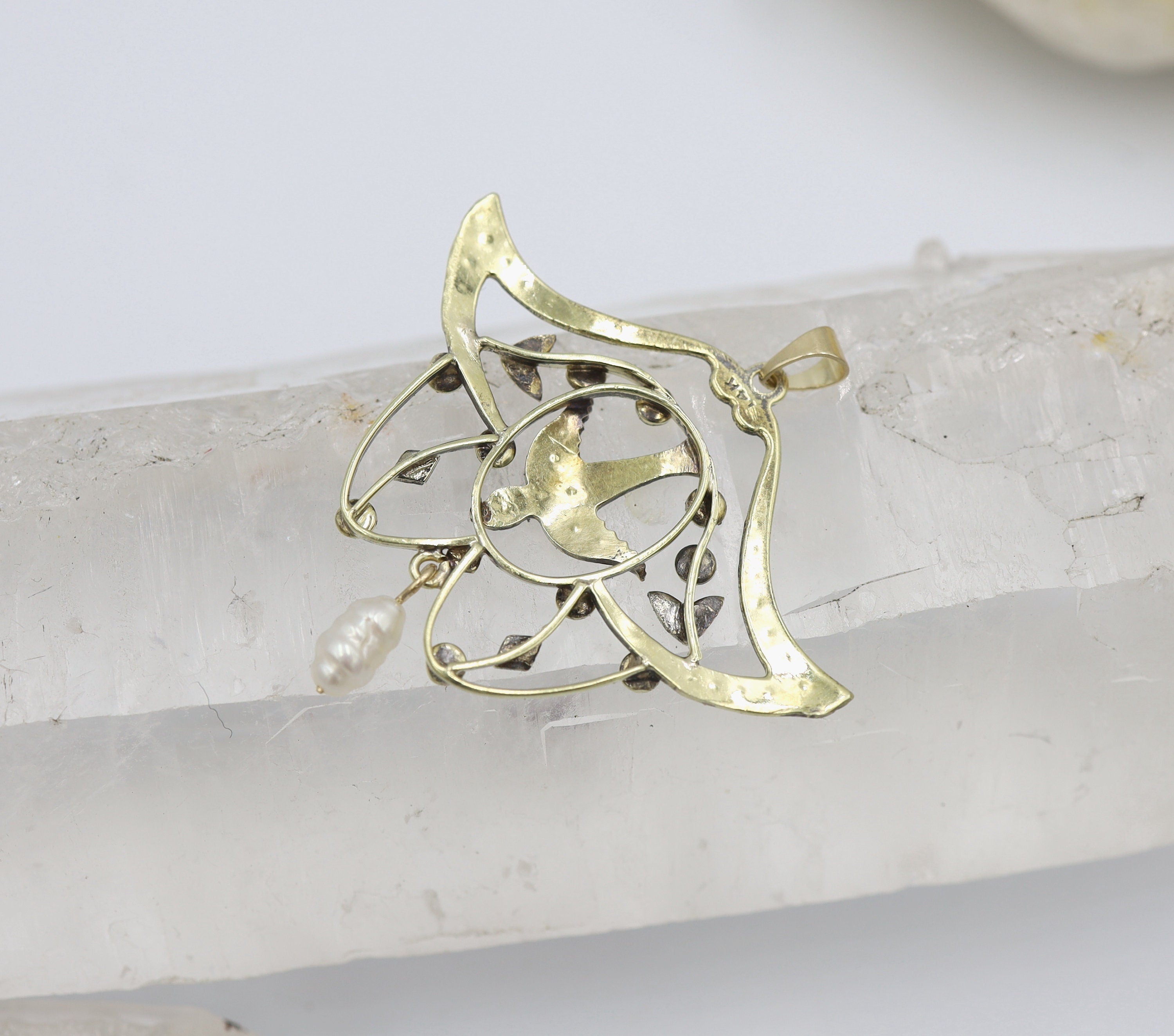 Large 14k gold Victorian lavalier necklace with pearl pendant featuring a bird design, showcasing intricate craftsmanship and elegance.