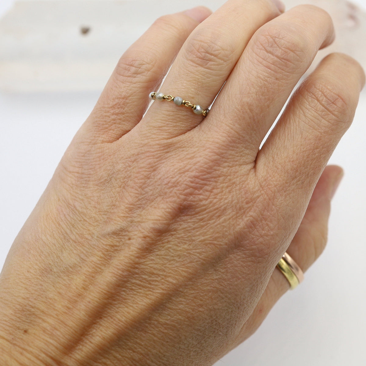 Vintage Pearl Chain Ring by The Vintage Vault featuring a delicate pearl adornment on a silver-toned ring.