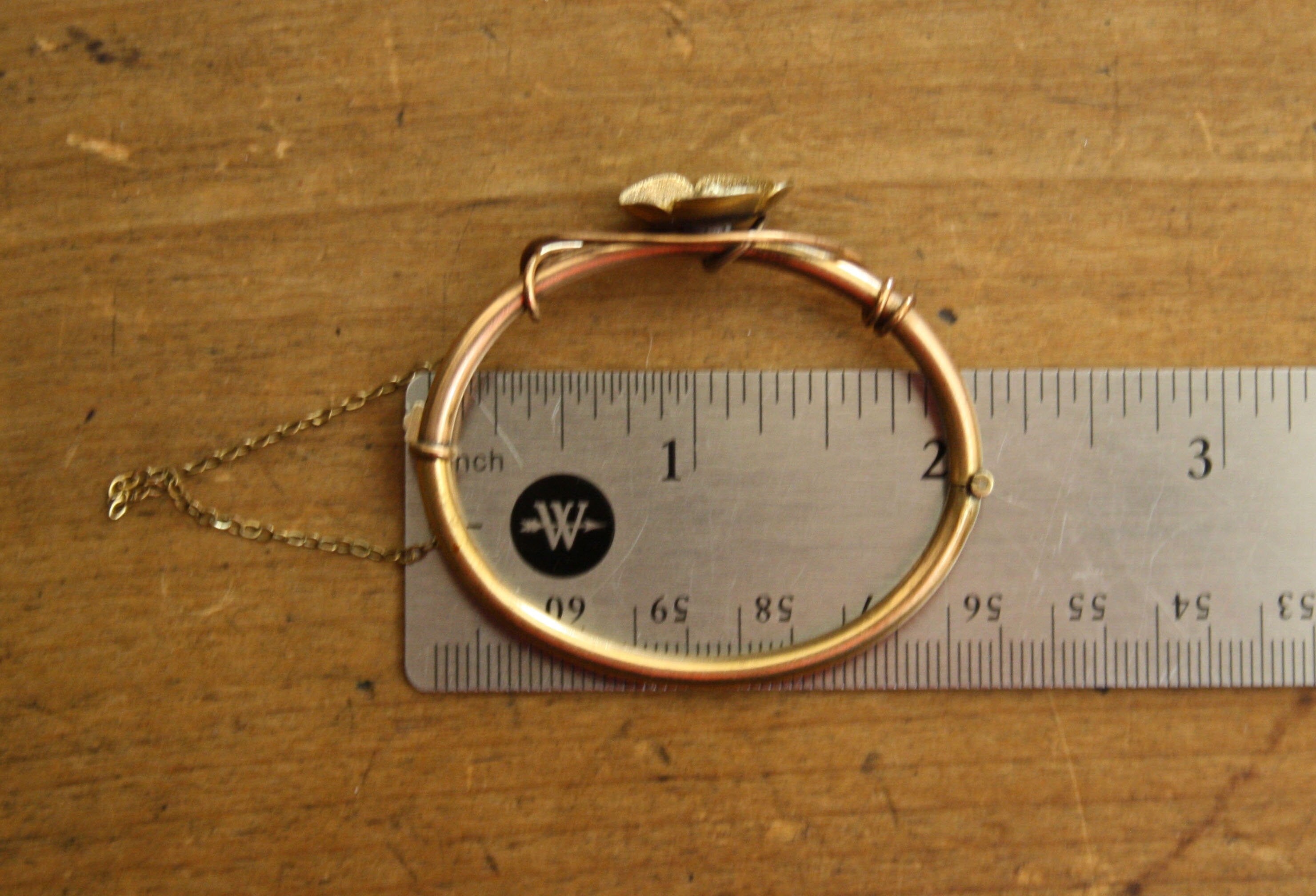 Gold-filled Victorian flower bangle bracelet for children, vintage style with intricate floral designs, suitable for young wearers.