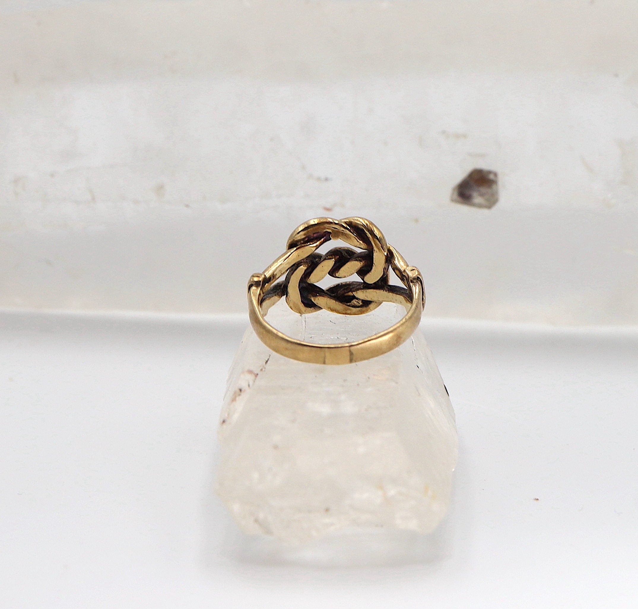 Vintage lovers knot ring in 9K gold, hallmarked 1976, English love knot band with intricate design from The Vintage Vault.