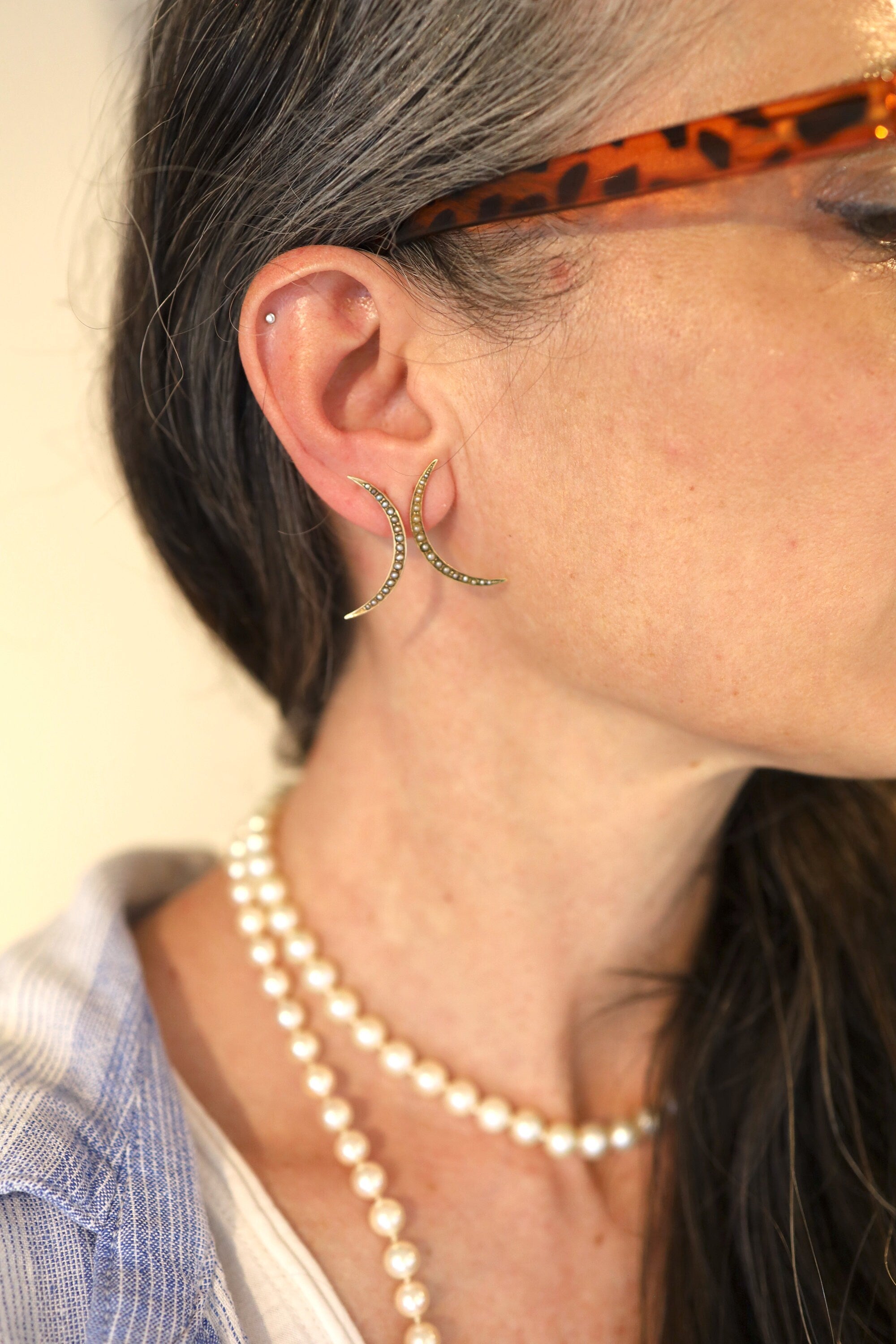 Victorian Crescent Moon Pearl Stud Earrings in 10k yellow gold featuring elegant pearl accents and vintage-inspired design.