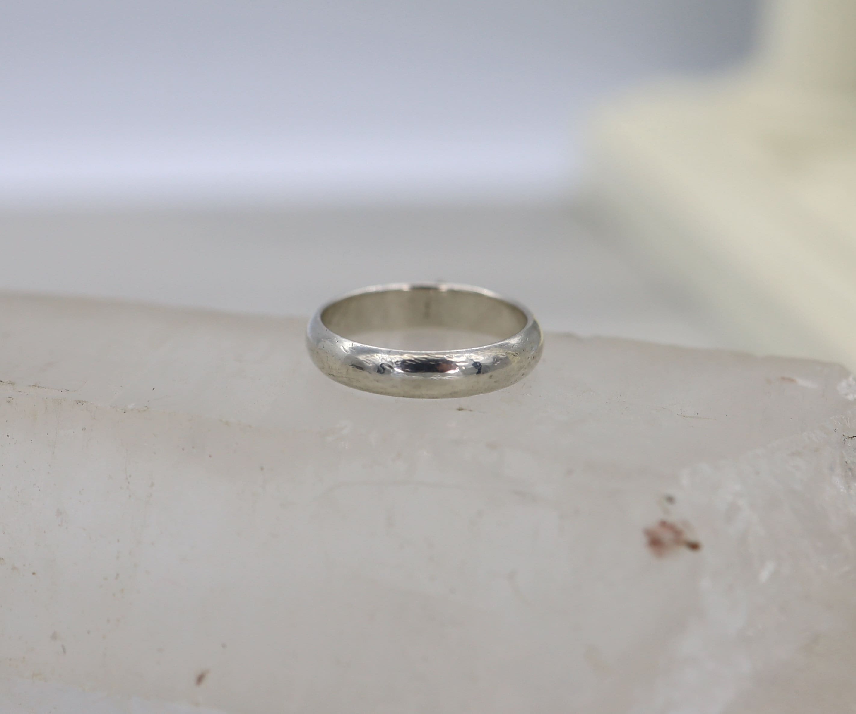 Silver Tiffany & Co. Heart Charm Ring in size 5.5 with a sleek design, featuring a delicate heart detail.
