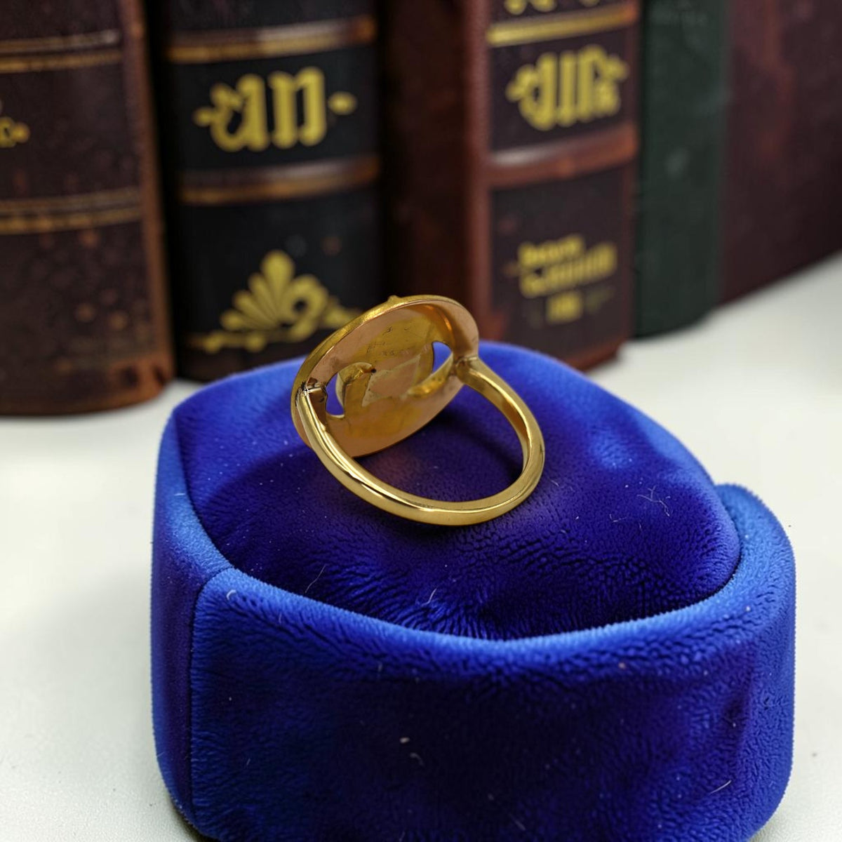 Back of the 18k gold Art Nouveau snake ring in a blue velvet ring box at Petra Star in Mystic, CT
