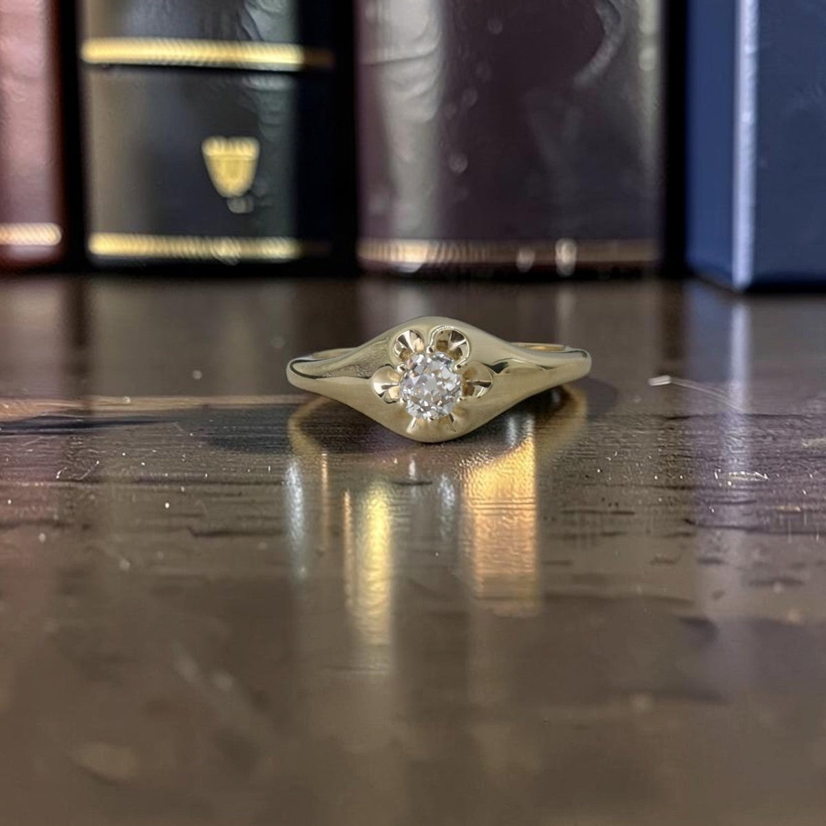 Belcher ring in 14k yellow gold with a 0.40 ct antique Old Mine cut diamond set low in carved claws, front view