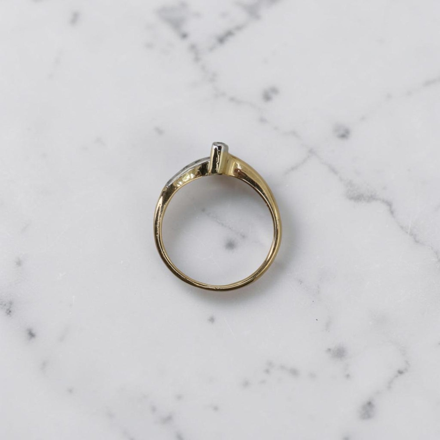 Edwardian diamond chevron ring in platinum and 18K gold with old European cut diamonds, vintage circa 1900, profile view.