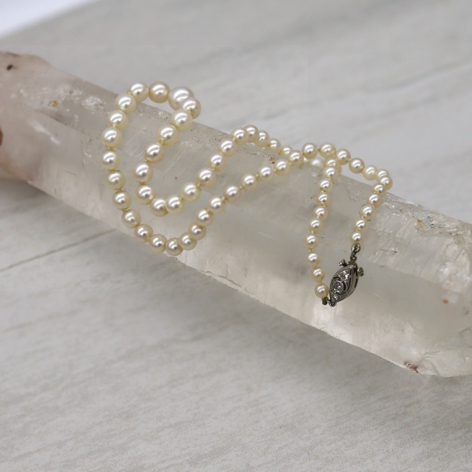 Platinum and Diamond Graduated Pearl Necklace - Petra Star