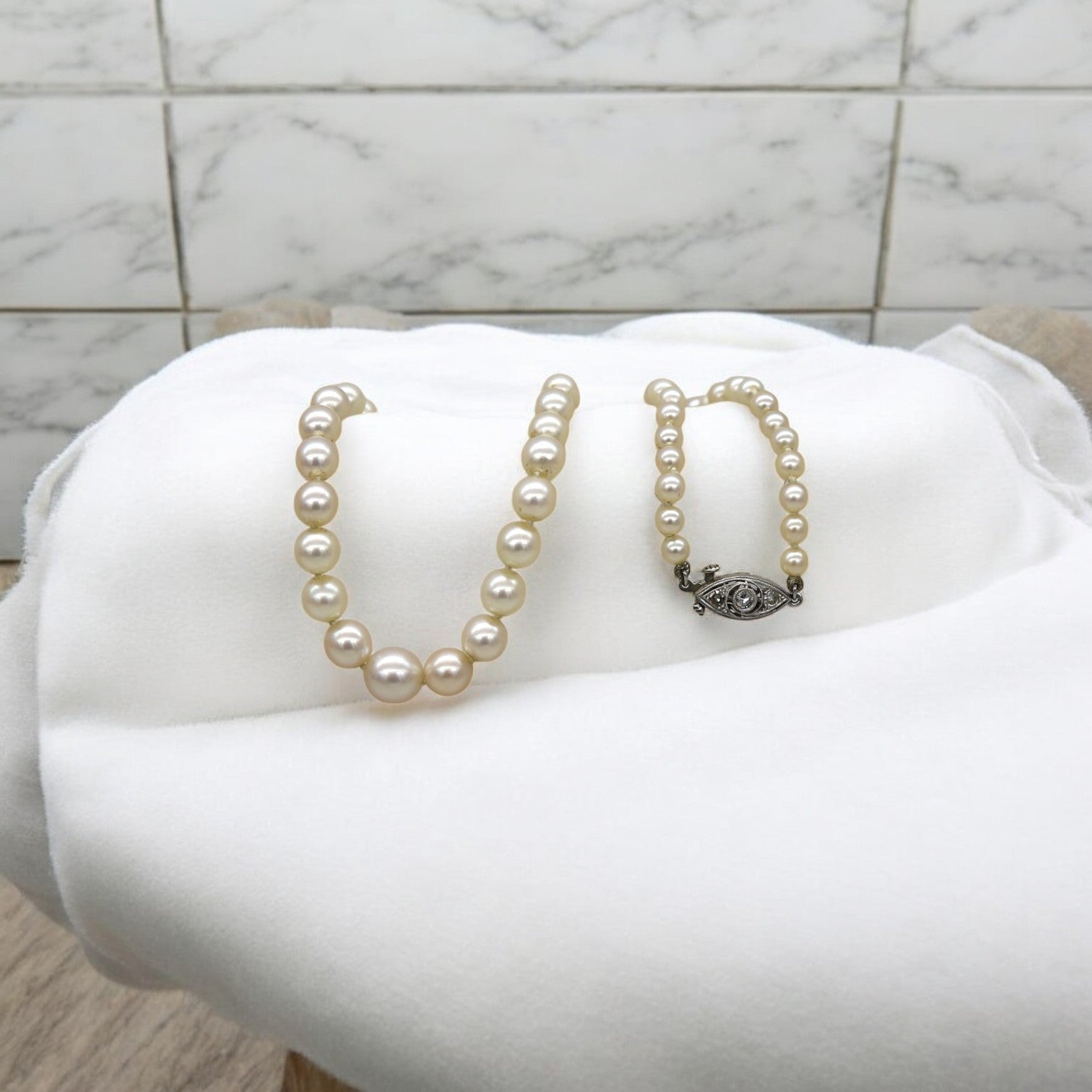 Platinum and Diamond Graduated Pearl Necklace - Petra Star