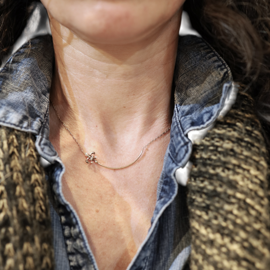 Victorian Fleur-de-Lys charm holder necklace in 10k gold with intricate design, from The Vintage Vault.