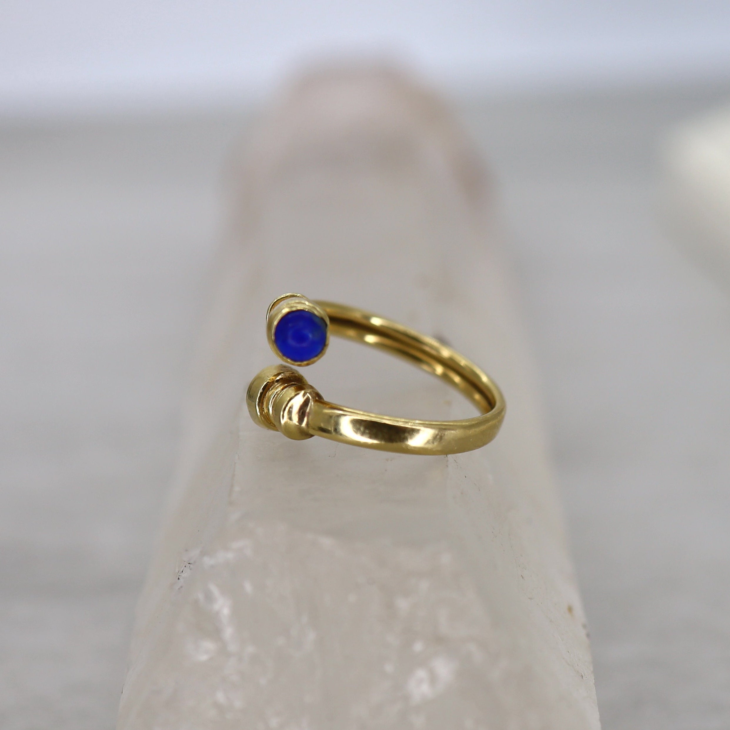 Vintage Lapis Bypass Ring crafted in 14k yellow gold with a vibrant lapis gemstone and sleek bypass design.