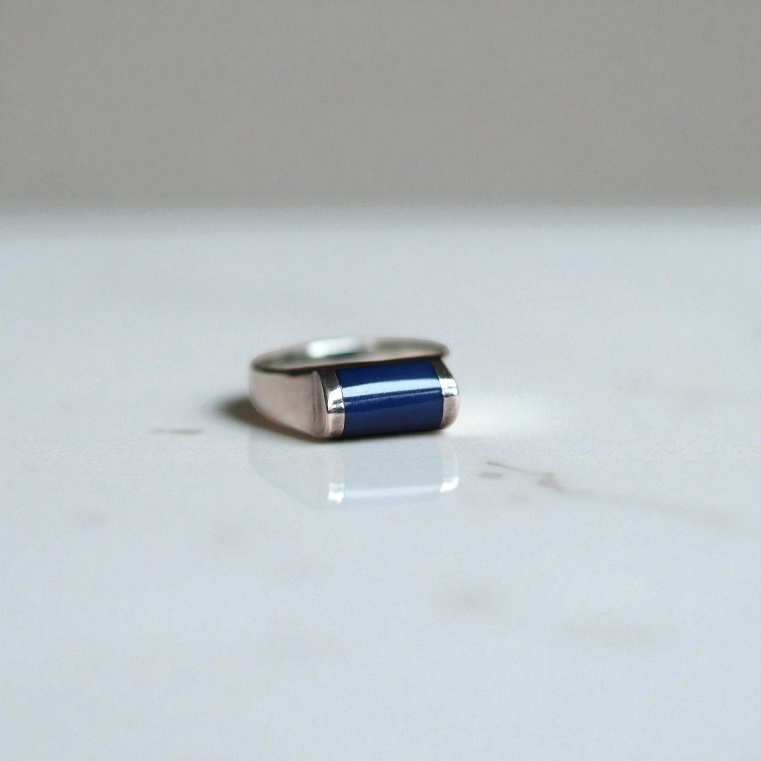 Estate silver lapis ring, blue enamel earrings, and pendant featuring modernist design from circa 1990.