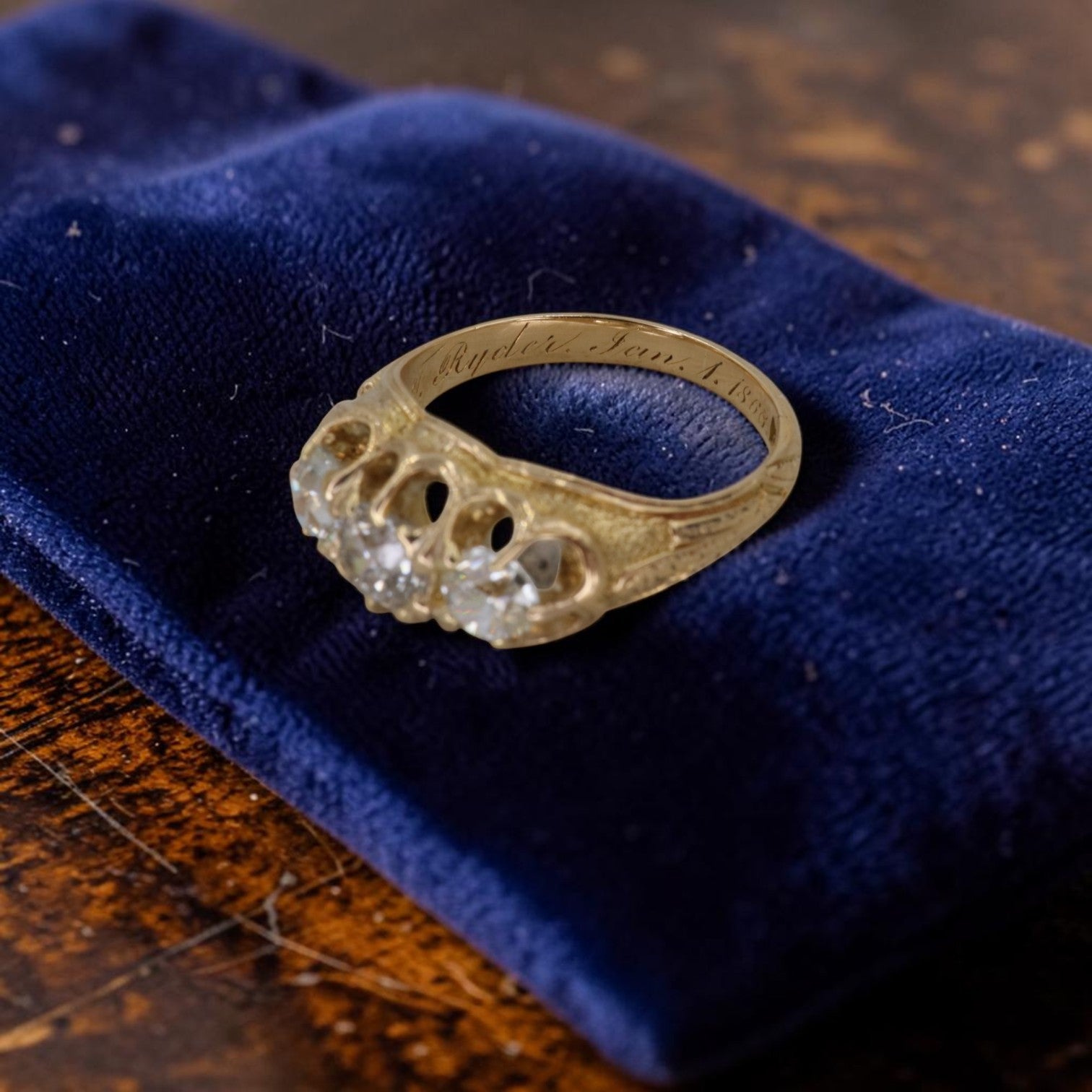 Antique Victorian 3 stone diamond ring in 18K gold with 0.93ct old mine cut diamonds, engraved date 1868, gypsy set trilogy band.